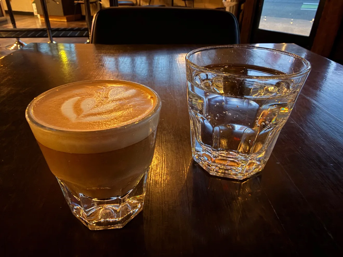 The Cortado, with a glass of water