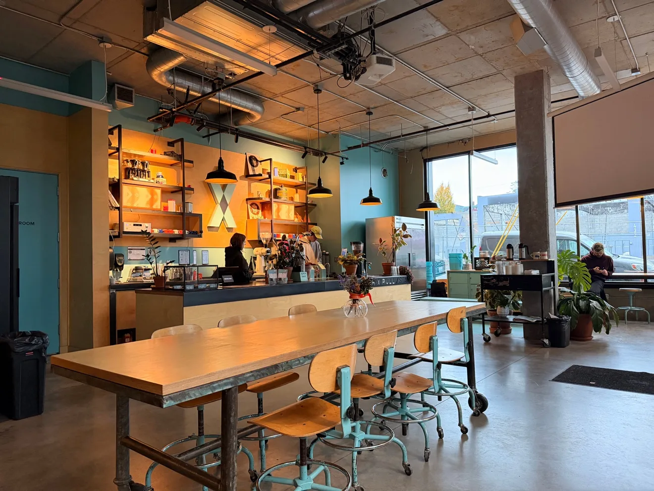 Inside Push Pull, with the long communal table