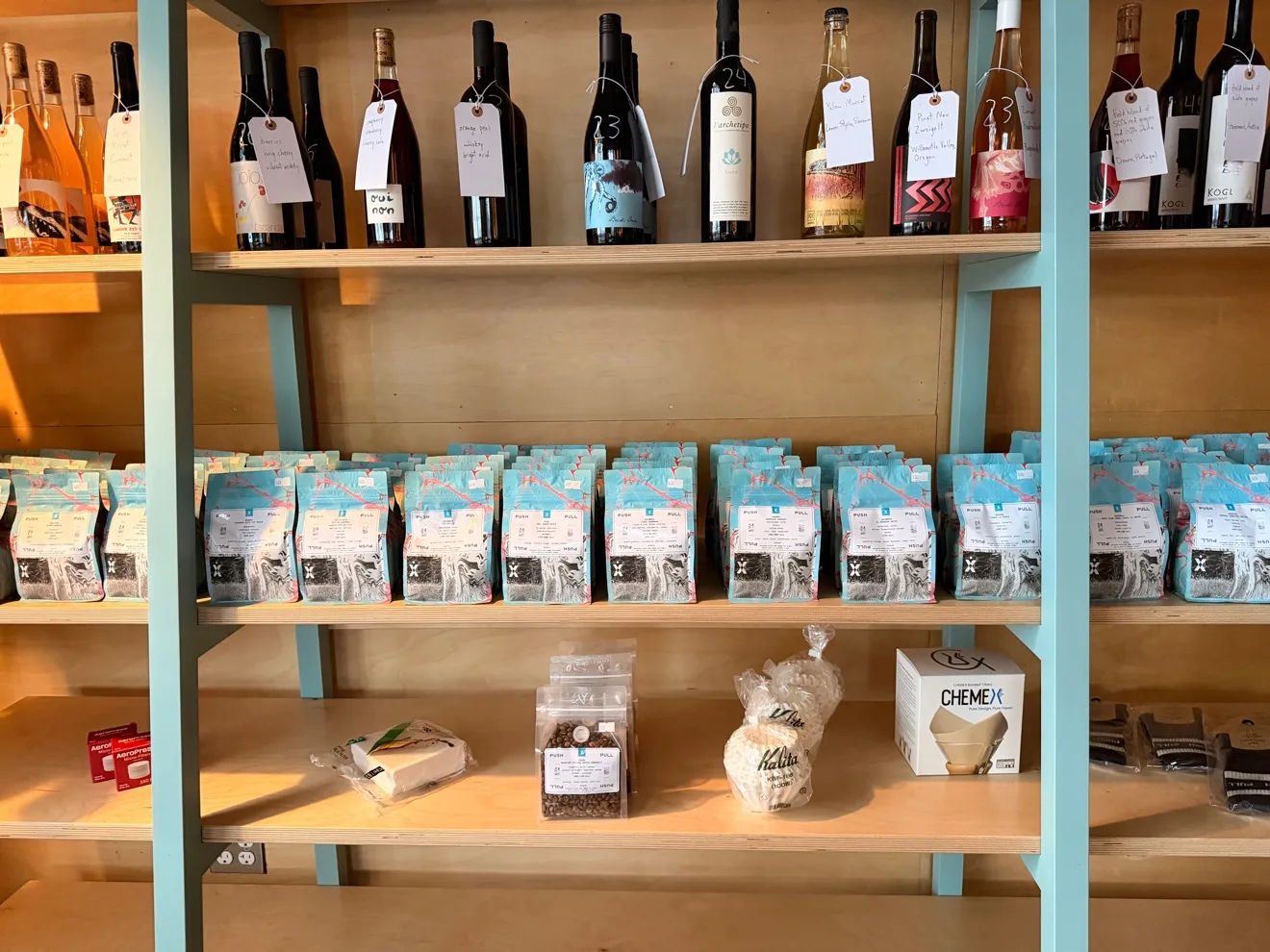 Beans and brewing gear on the shelves